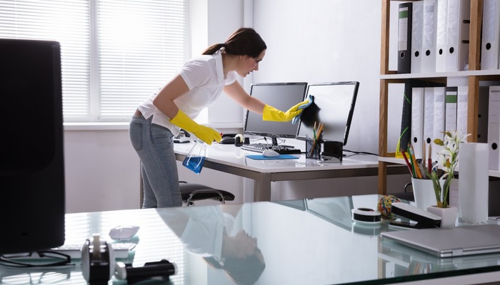 Woman cleaning an office