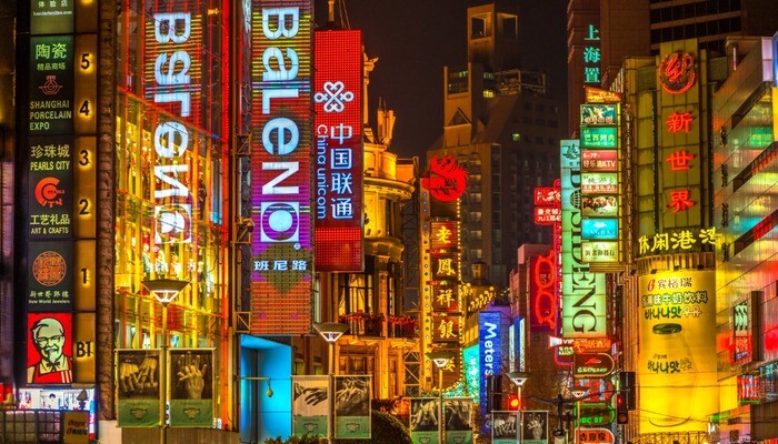 Neon signs lit on Nanjing Road in Shanghai, China