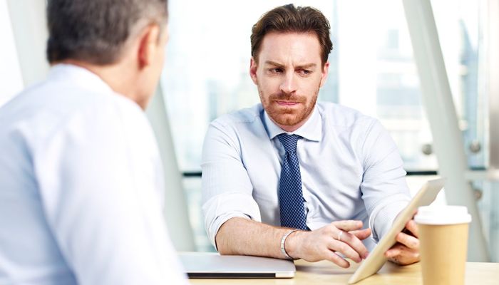 Man conducting performance review in the office
