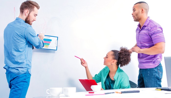 A marketing team brainstorming over a purchasing funnel