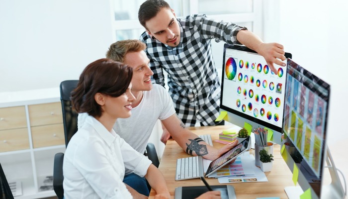 An entrepreneur explaining a concept to his employees