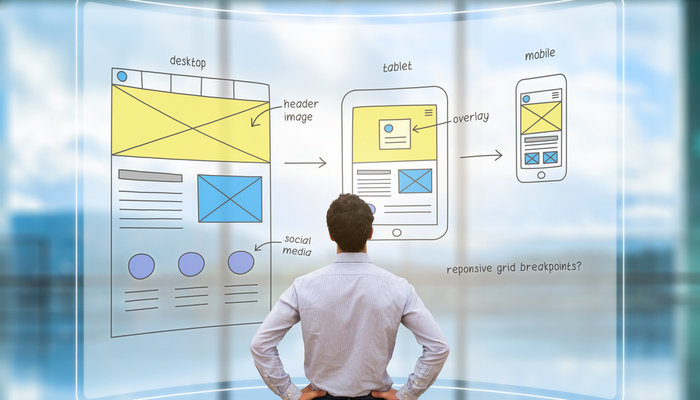Businessman reviewing website wireframes